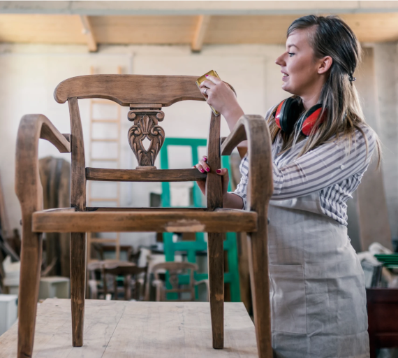 Woman making a wooden chair