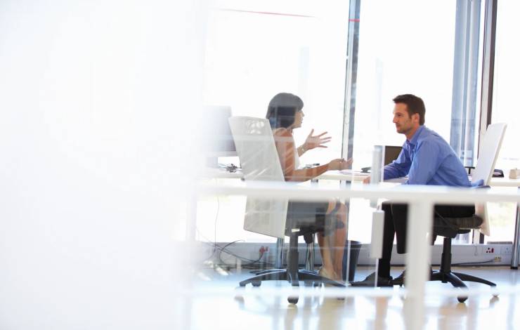 two colleagues meeting in an office