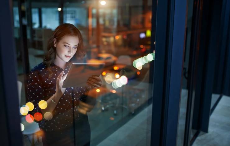 young woman in office with tablet