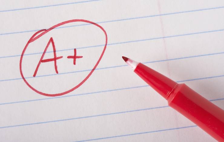A+ in red on lined paper