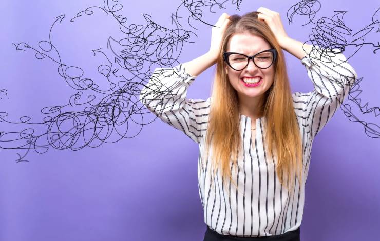 frustrated woman on purple background