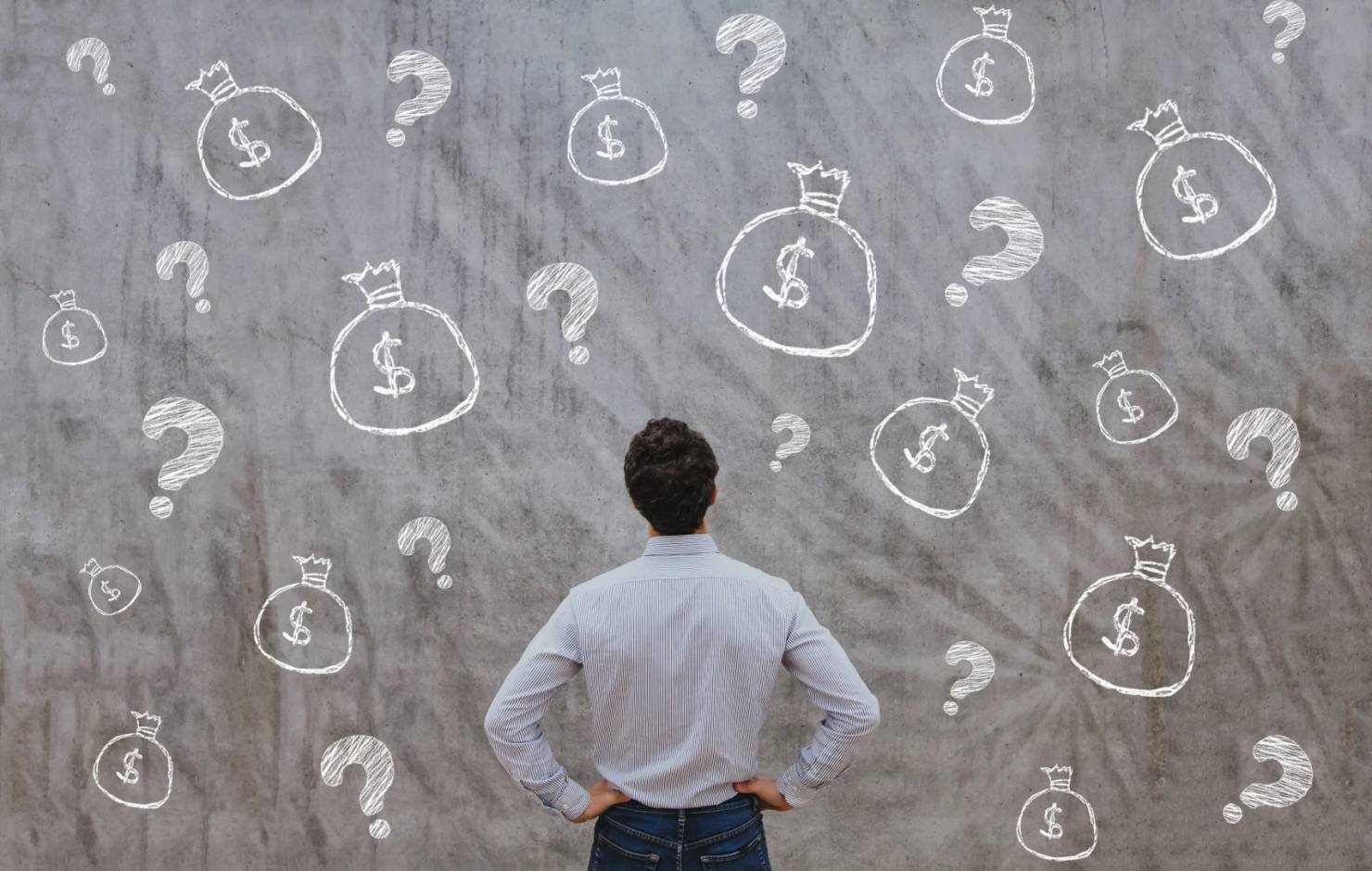 man staring at wall with money drawn on it