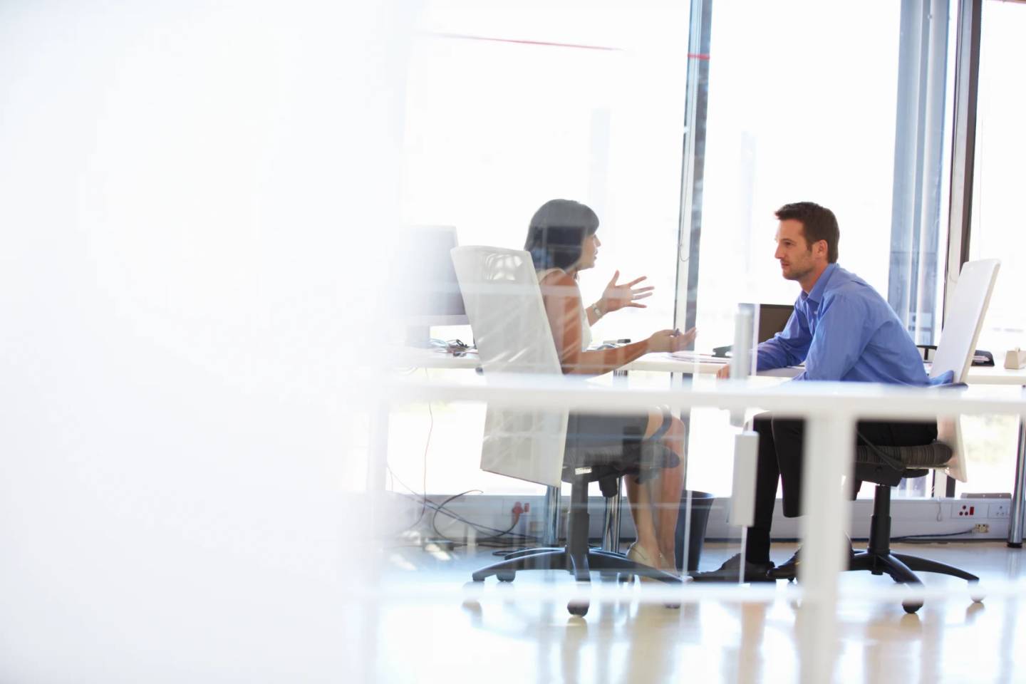two colleagues meeting in an office