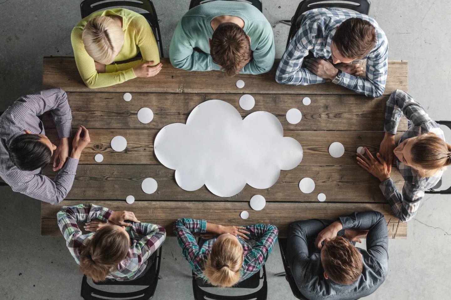 people brainstorming around table