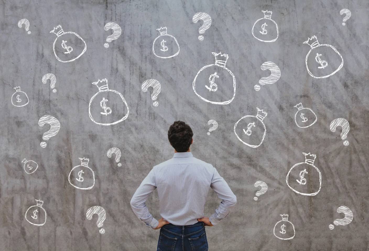 man staring at wall with money drawn on it