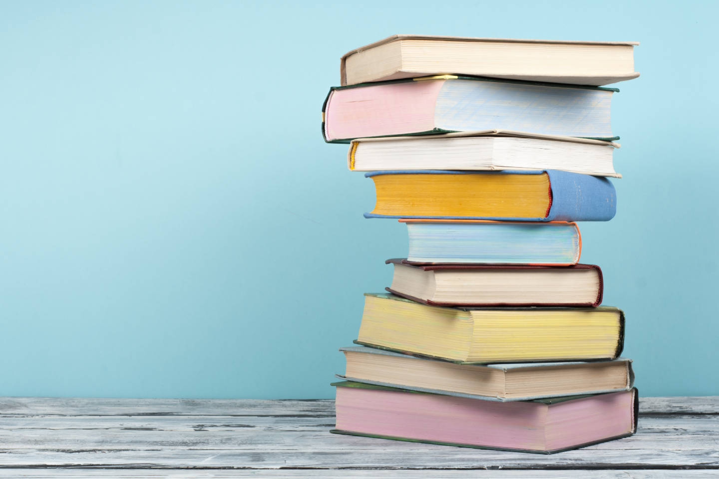 stack of books on a desk