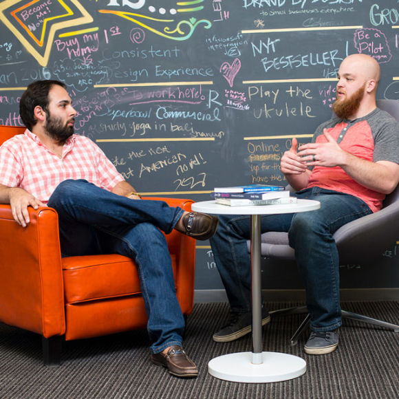 two people relaxing and discussing something
