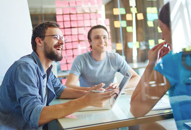 Two men and a woman planning and being productive.
