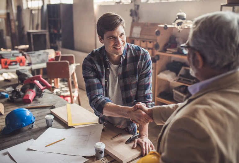 Contractor shaking hands with customer